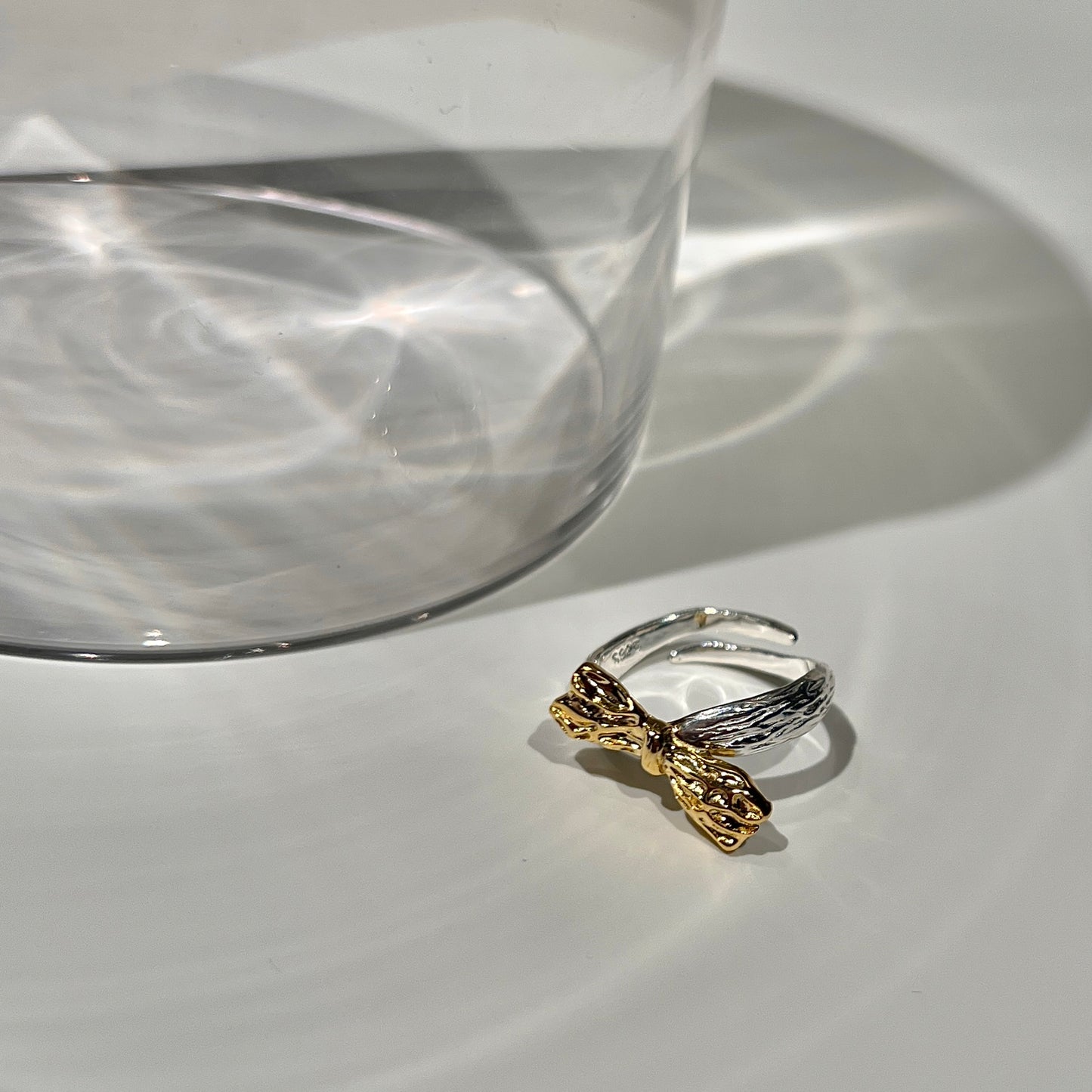 «GOLD BOW RING» — Adjustable Sterling Silver Band with Textured Gold Bow